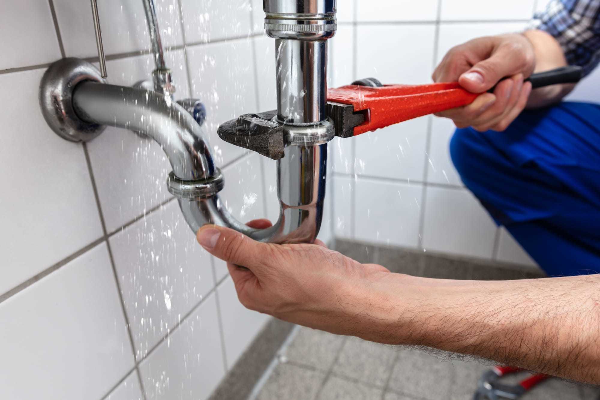 leak under kitchen sink uk